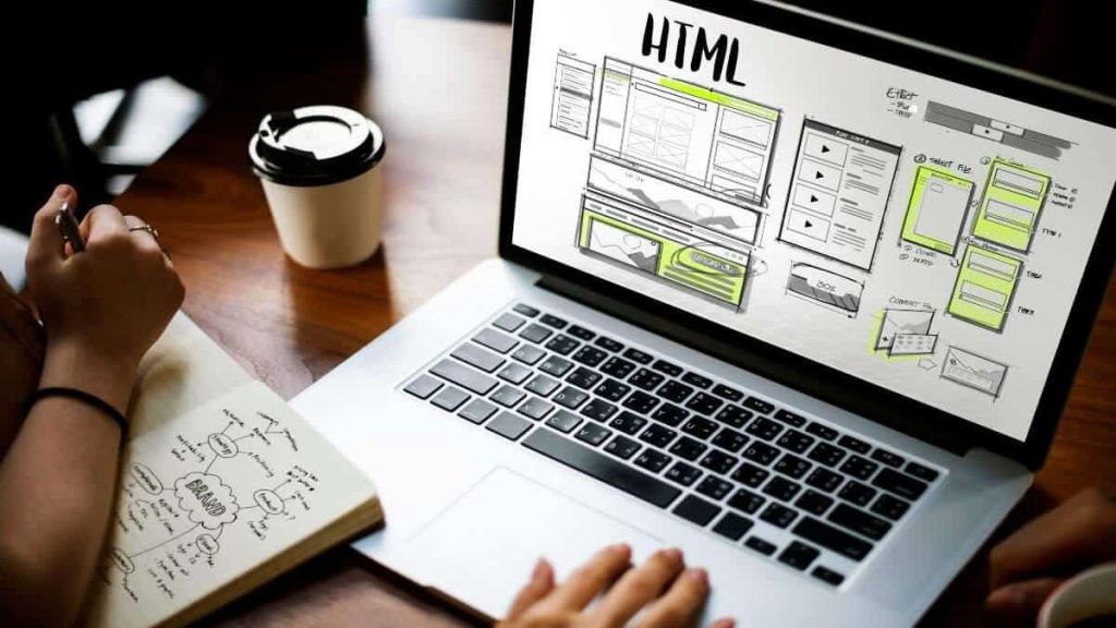 How to Work with A Web Designer: Working on a laptop.