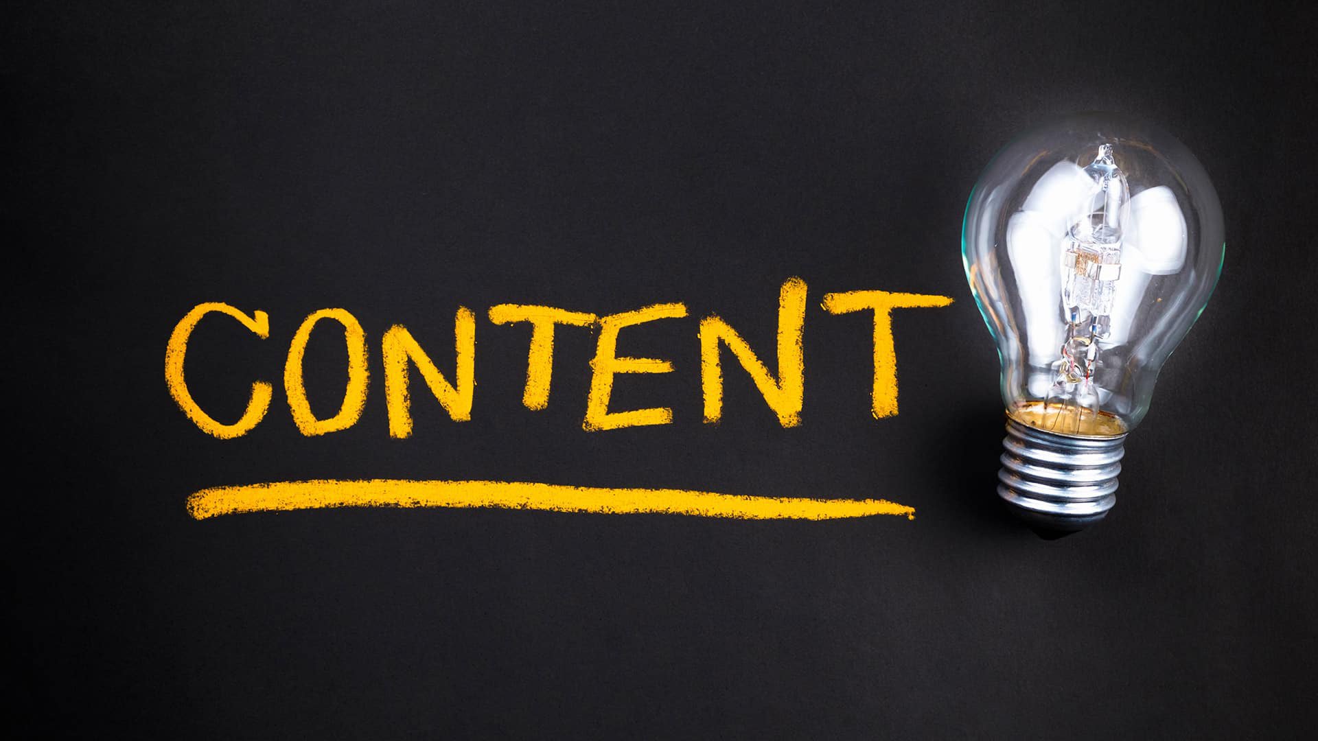 Website content with a lightbulb on a dark background.